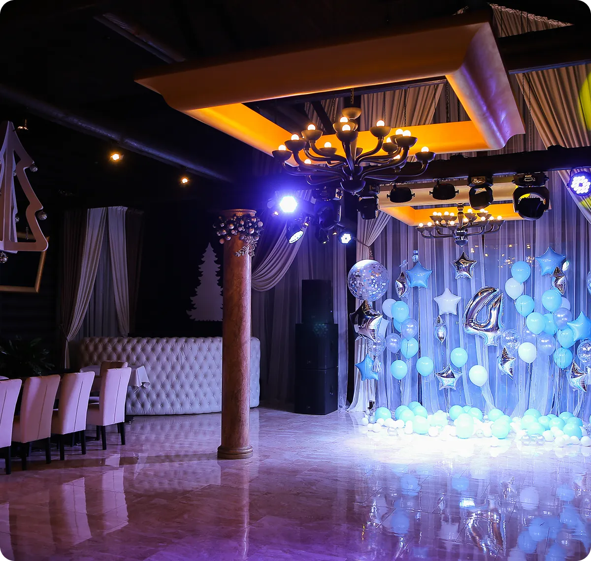 Decorated event space with blue balloons display.